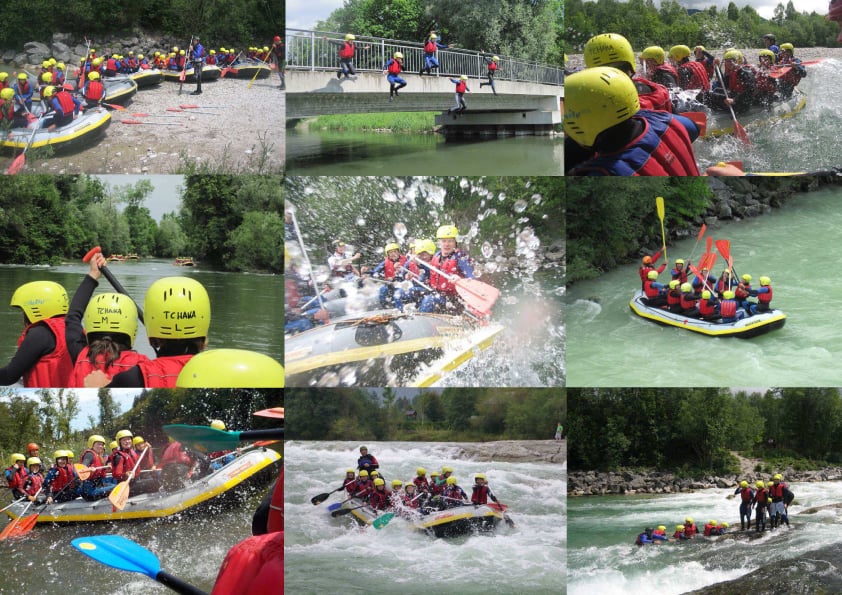 Groups of people wearing yellow helmets and red life jackets raft together on a river, preparing and navigating whitewater activities on a sunny day.