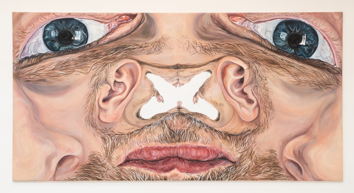 Surreal painting of two men’s faces pressed together, viewed from above, with prominent blue eyes and heavy facial hair.