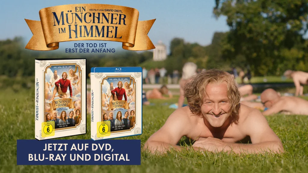EinMuenchnerImHimmel_1920x1080_2 - IN München - Das Stadtmagazin Promotional banner for the film'Ein Münchner im Himmel' with DVD/Blu-ray cases on grass and a man lying in the foreground.','German film poster with the ribbon title and DVD/Blu-ray artwork in the foreground on a park lawn.','Advertisement banner reading 'JETZT AUF DVD, BLU-RAY UND DIGITAL' showing movie covers against a grassy park scene.','Hero image for a movie release: two DVD cases displayed on grass with a smiling man in the foreground and parkgoers blurred in the background.','Movie promotion shot: golden ribbon title 'Ein Münchner im Himmel' above disc cases on grass, signaling available on DVD/Blu-ray and digital.