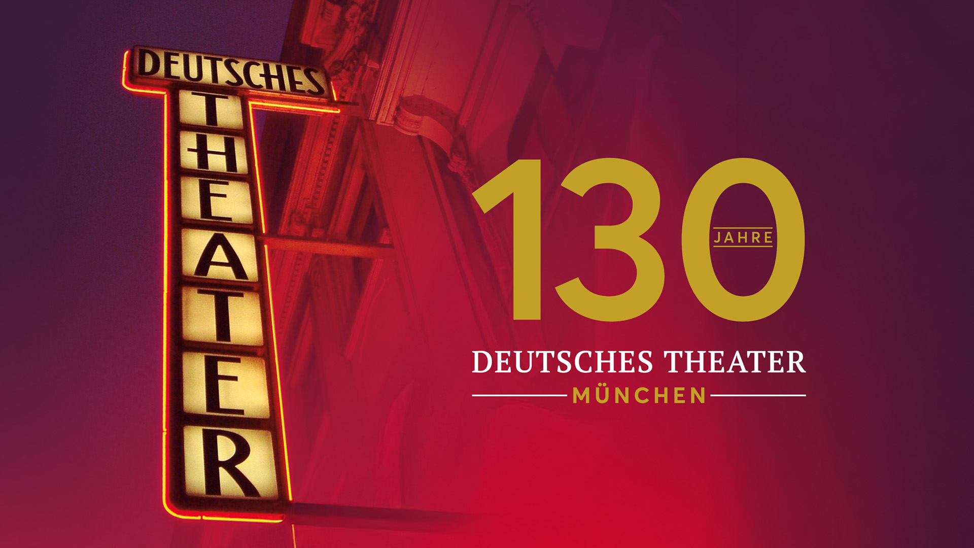 Neon-lit sign for Deutsches Theater München celebrating 130 Jahre (130 years). No people in frame, bold anniversary banner on burgundy background.