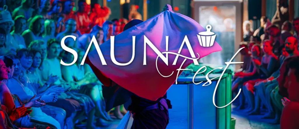 sauna-fest-online-grafik-1200x520 - IN München - Das Stadtmagazin Promotional banner for Sauna Fest with a performer under colorful lights and a cheering audience, logo overlay reads SAUNA Fest.